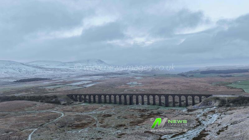 Snow falls on Pen-y-ghent and Ribblehead Viaduct area of the Yorkshire Dales