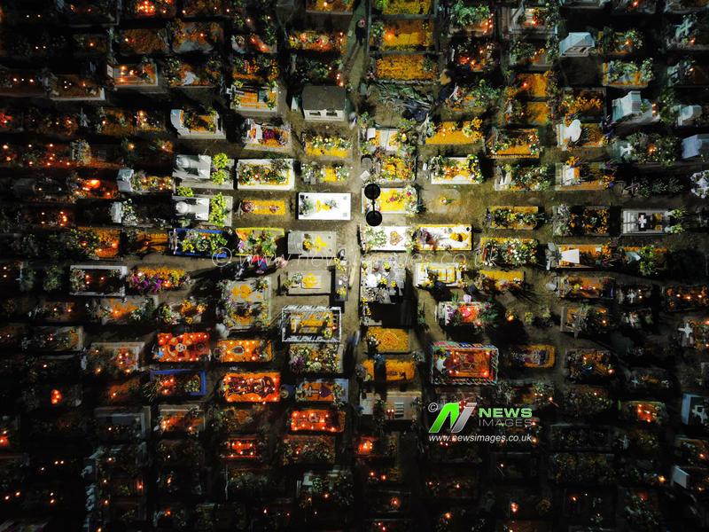 Mexico: People Visit San Andres Mixquic cemetery on Dia de Muertos Celebration