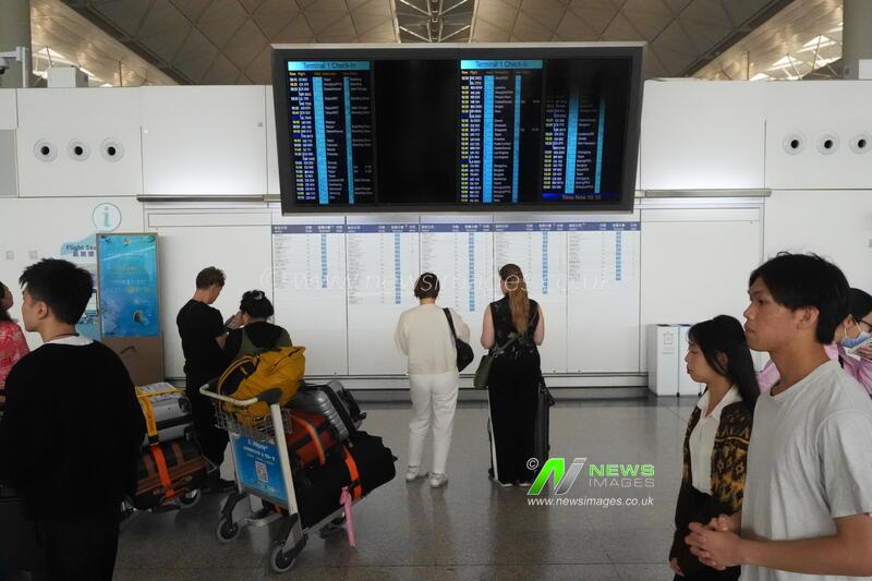 Travelers at Hong Kong Airport in Hong Kong - 01 Apr 2026