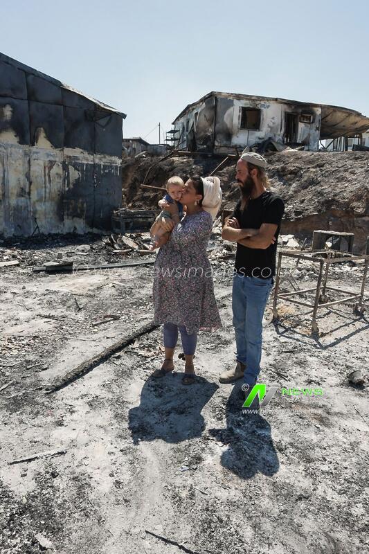 Havat Gilad Couple Sifts Through Ashes After Arson Attack Destroys Family Business