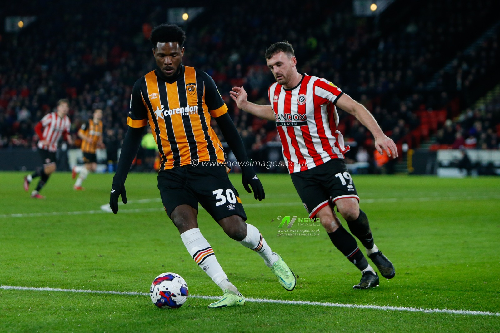 Benjamin Tetteh #30 of Hull City and Jack Robinson #19 of Sheffield United during the Sky Bet Championship match Sheffield United vs Hull City at Bramall Lane, Sheffield, United Kingdom, 20th January 2023

(Photo by Ben Early/News Images)