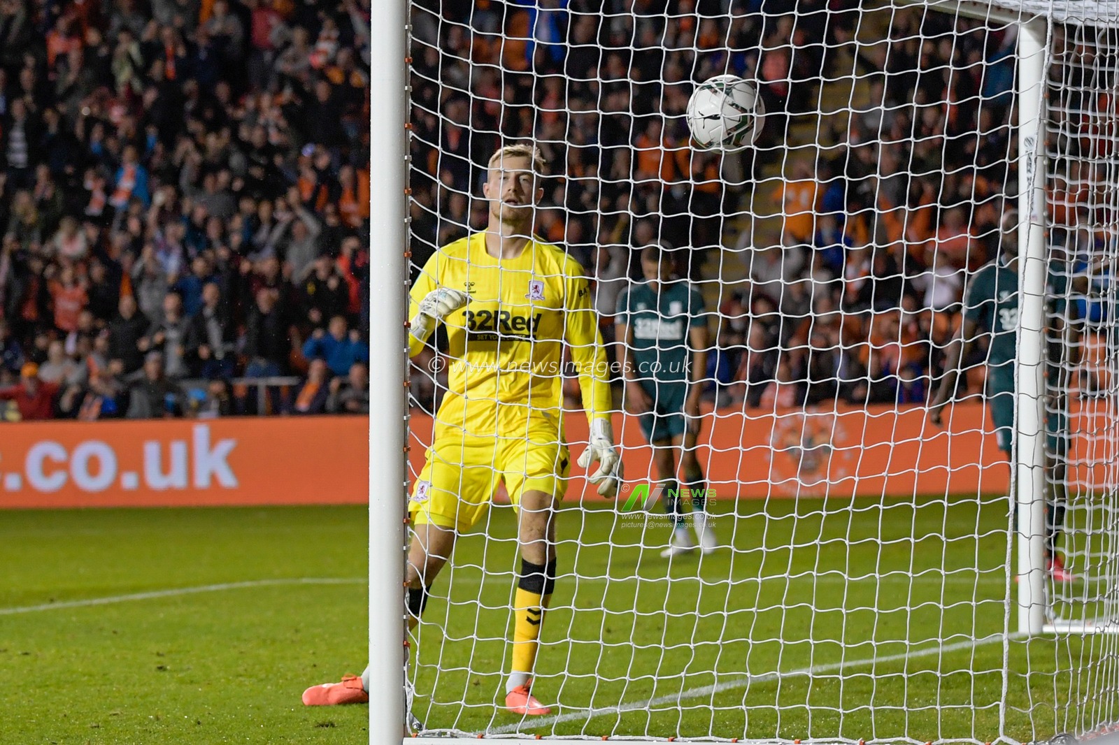 Joe Lumley #1 of Middlesbrough watches the ball into the net as Keshi Anderson #10 of Blackpool (not pictured) puts Blackpool 3-0 up