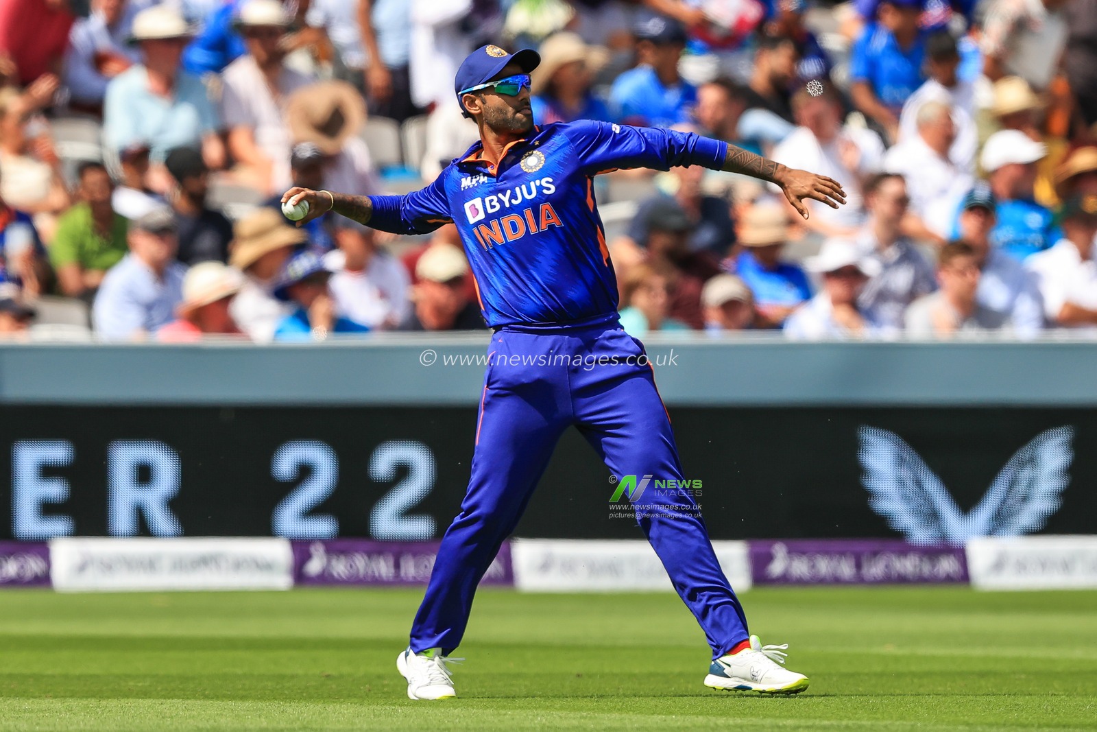 Suryakumar Yadav of India throws to the stumps