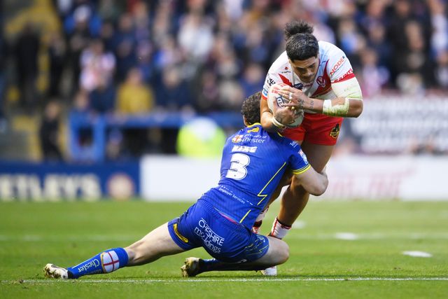 Sione Mata'utia of St. Helens is challenged by Toby King of Warrington Wolves during the Betfred Super League play-off Eliminator 2 Warrington Wolves v St Helens at Halliwell Jones Stadium, Warrington, United Kingdom, 28th September 2024

(Photo by Ben Roberts/News Images)