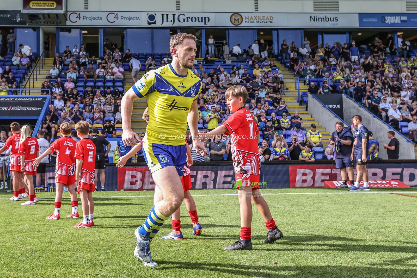 Ben Currie of Warrington Wolves comes out for the game during the Betfred Super League round 16 match Warrington Wolves vs Hull FC at Halliwell Jones Stadium, Warrington, United Kingdom, 28th June 2025

(Photo by Alfie Cosgrove/News Images)