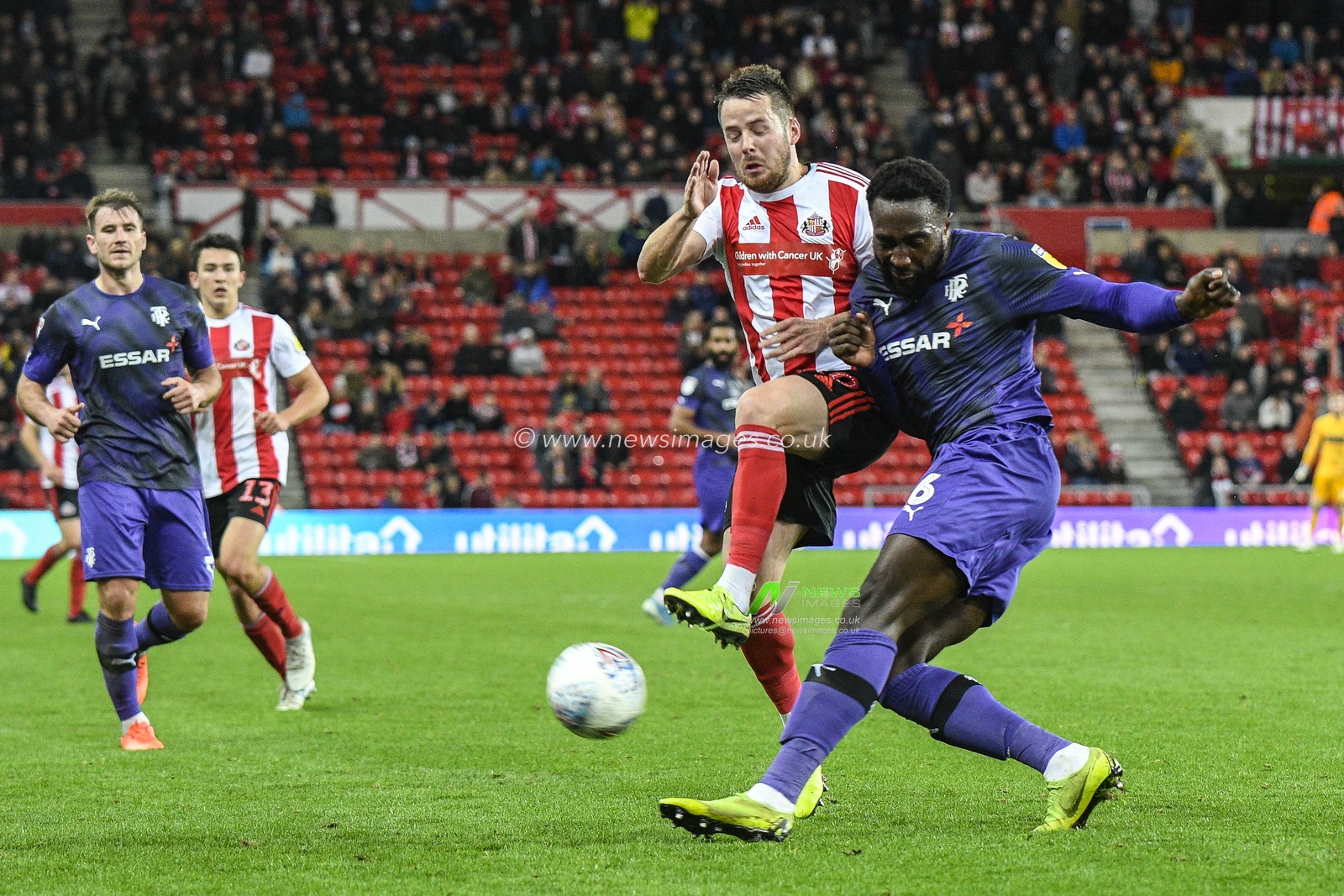 22nd October 2019, Stadium Of Light, Sunderland, England; Sky Bet League 1, Sunderland v Tranmere Rovers : Emmanuel Monthe of Tranmere Rovers clears the ball under pressure from Marc McNulty of Sunderland

Credit: Iam Burn/News Images