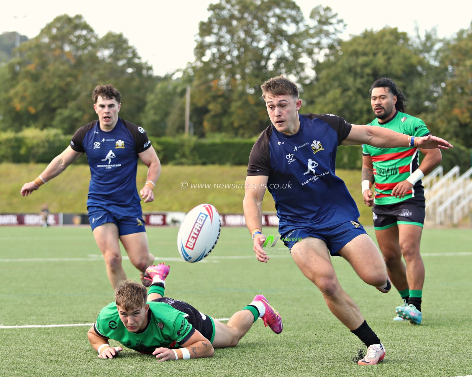 Kieran Taylor of North Wales Crusaders chases the ball during the Betfred League 1 match North Wales Crusaders vs Keighley Cougars at Stadiwm CSM, Colwyn Bay, United Kingdom, 31st August 2025(Photo by Sam Eaden/News Images)