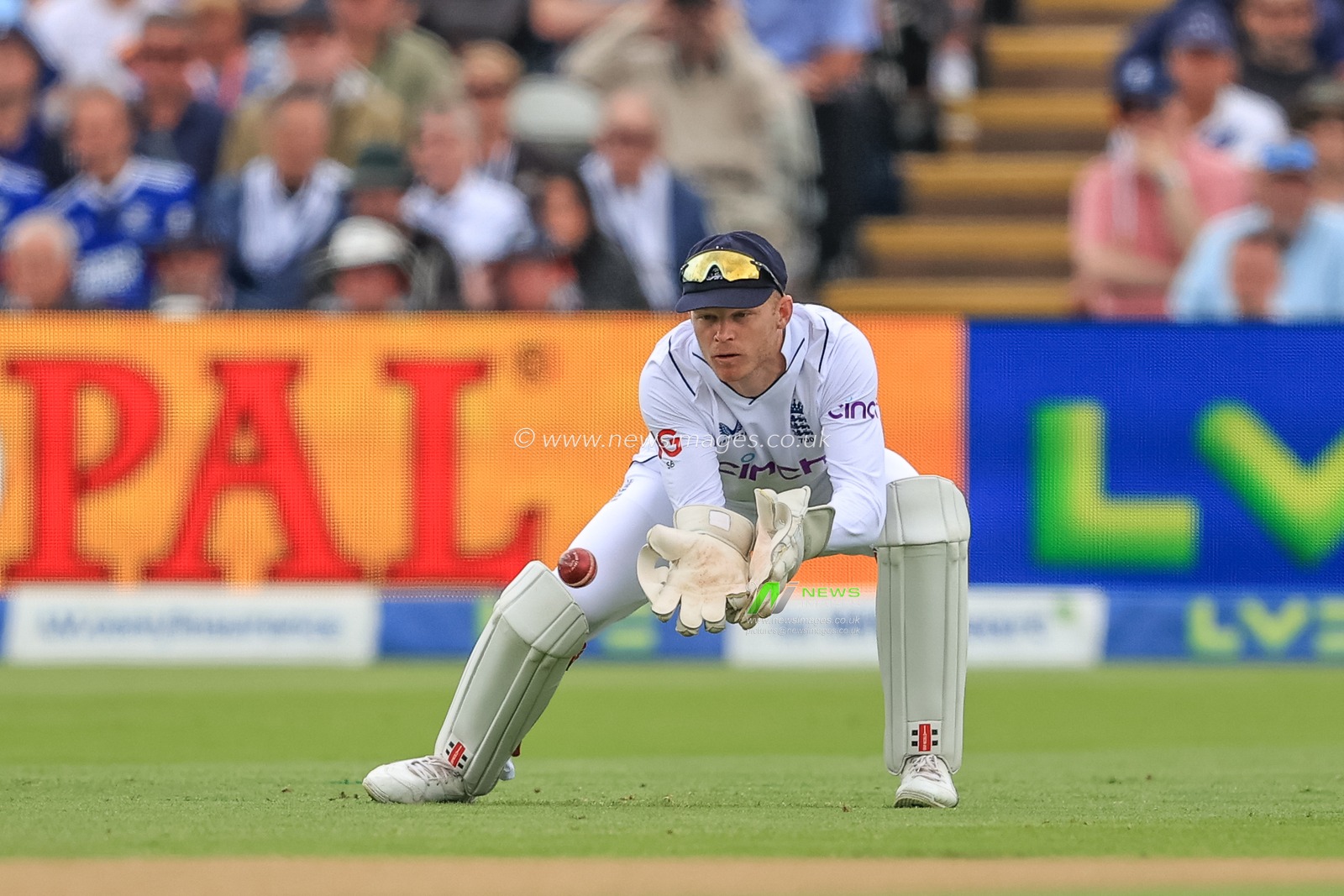 Sam Billings of England collects the ball