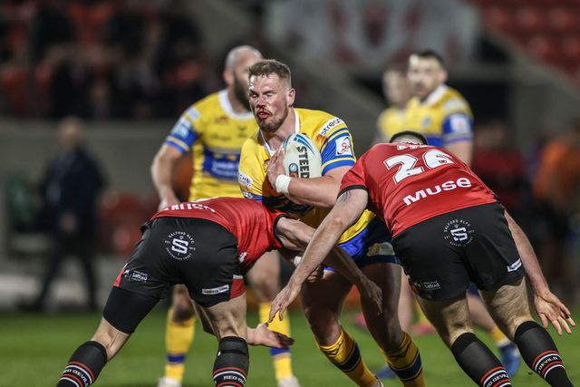 Tom Holroyd of Leeds Rhinos is tackled during the Betfred Super League match Salford Red Devils vs Leeds Rhinos at Salford Community Stadium, Eccles, United Kingdom, 10th April 2025

(Photo by Alfie Cosgrove/News Images)