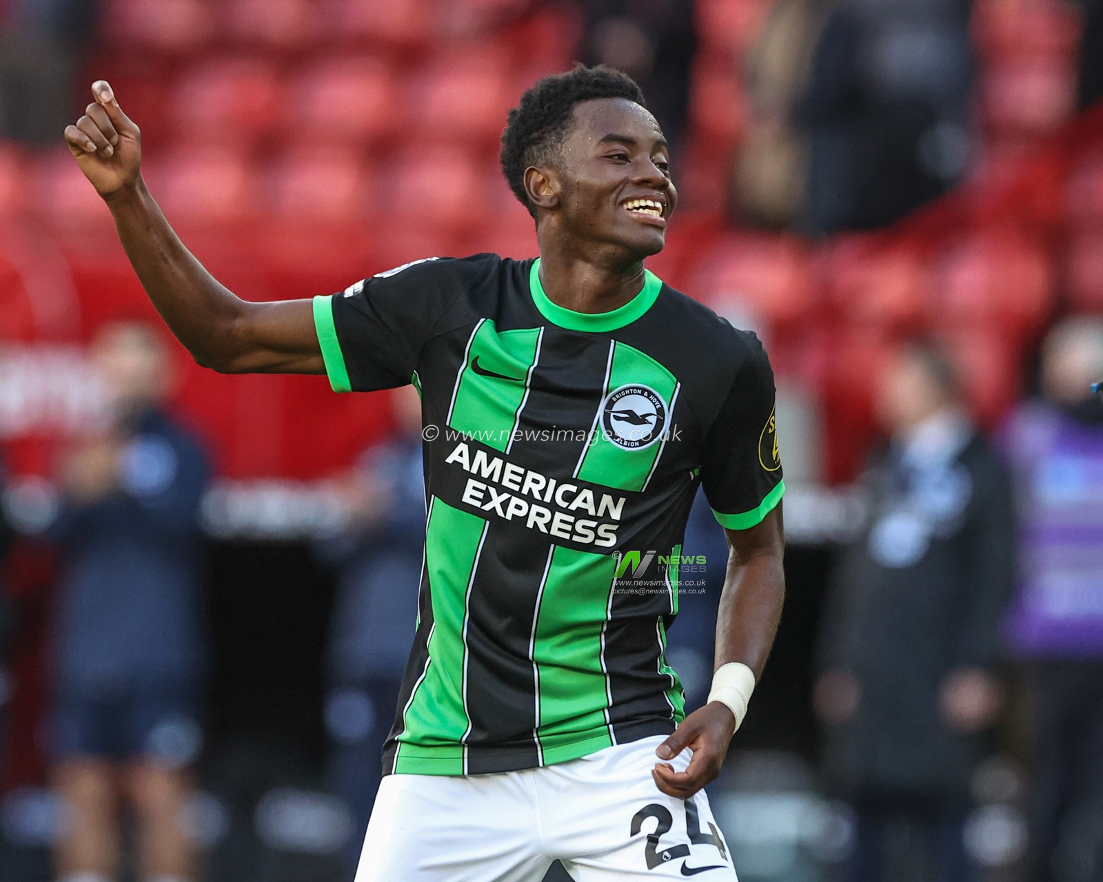 Simon Adingra of Brighton & Hove Albion celebrates with the fans after the game during the Premier League match Sheffield United vs Brighton and Hove Albion at Bramall Lane, Sheffield, United Kingdom, 18th February 2024

(Photo by Mark Cosgrove/News Images)