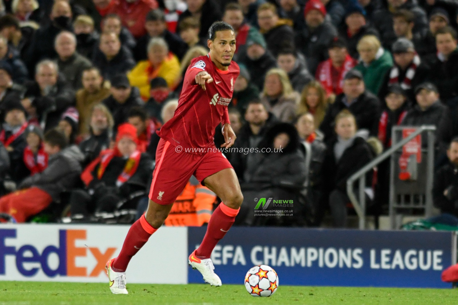 Virgil van Dijk #4 of Liverpool runs forward with the ball