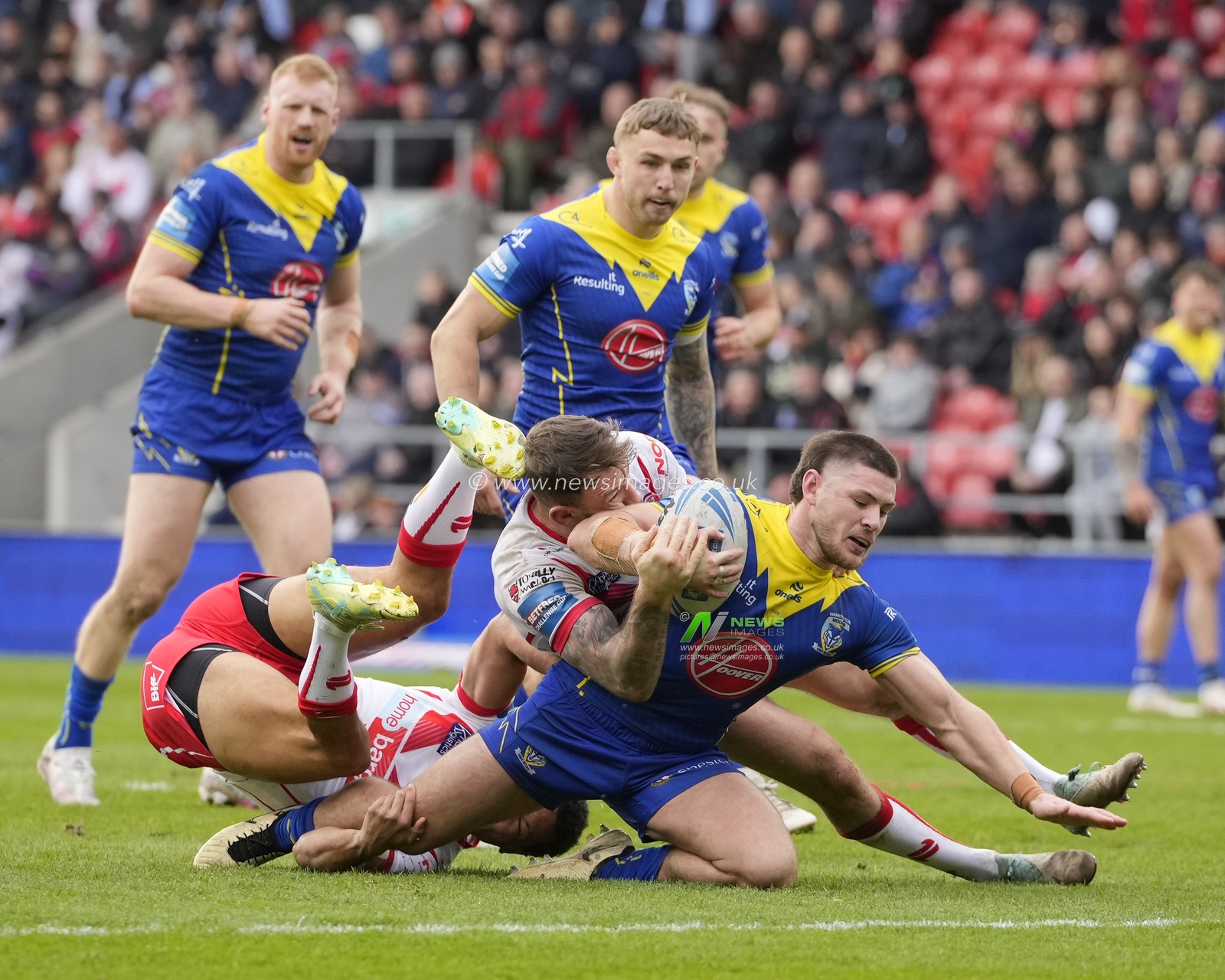 Daryl Clark of St. Helens tackles Danny Walker of Warrington Wolves during the Betfred Challenge Cup Quarter Final match St Helens vs Warrington Wolves at Totally Wicked Stadium, St Helens, United Kingdom, 14th April 2024

(Photo by Steve Flynn/News Images)