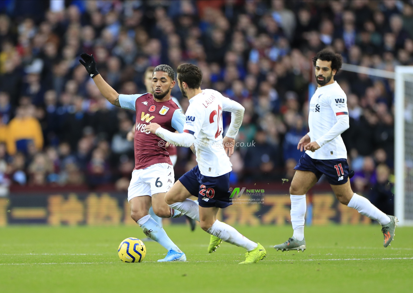 2nd November 2019, Villa Park, Birmingham, England; Premier League, Aston Villa v Liverpool : Douglas Luiz (6) of Aston Villa and Adam Lallana (20) of Liverpool challenge for the ball

Credit: Conor Molloy/News Images