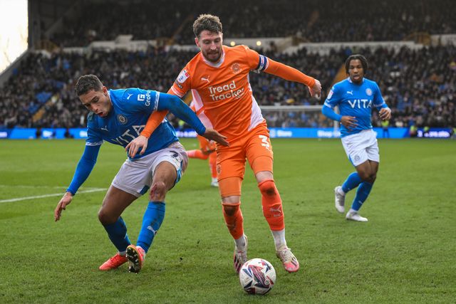 James Husband of Blackpool battles with Kyle Knoyle of Stockport County during the Sky Bet League 1 match Stockport County vs Blackpool at Edgeley Park Stadium, Stockport, United Kingdom, 1st March 2025

(Photo by Craig Thomas/News Images)