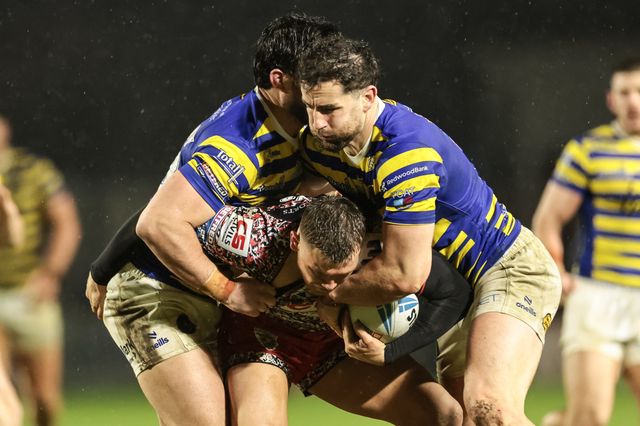 Keanan Brand of Leigh Leopards is tackled by James Bentley of Warrington Wolves and Toby King of Warrington Wolves during the Pre Season match Warrington Wolves vs Leigh Leopards at Halliwell Jones Stadium, Warrington, United Kingdom, 30th January 2026

(Photo by Mark Cosgrove/News Images)