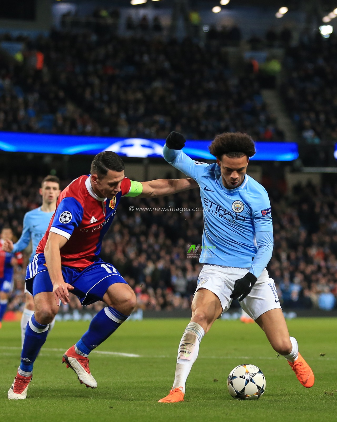7th March 2018 , Etihad Stadium, Manchester, England; Champions League Round of 16 leg 2, Manchester City versus FC Basel; Marek Suchy #17 of Basel challenges Leroy Sane #19 of Manchester City