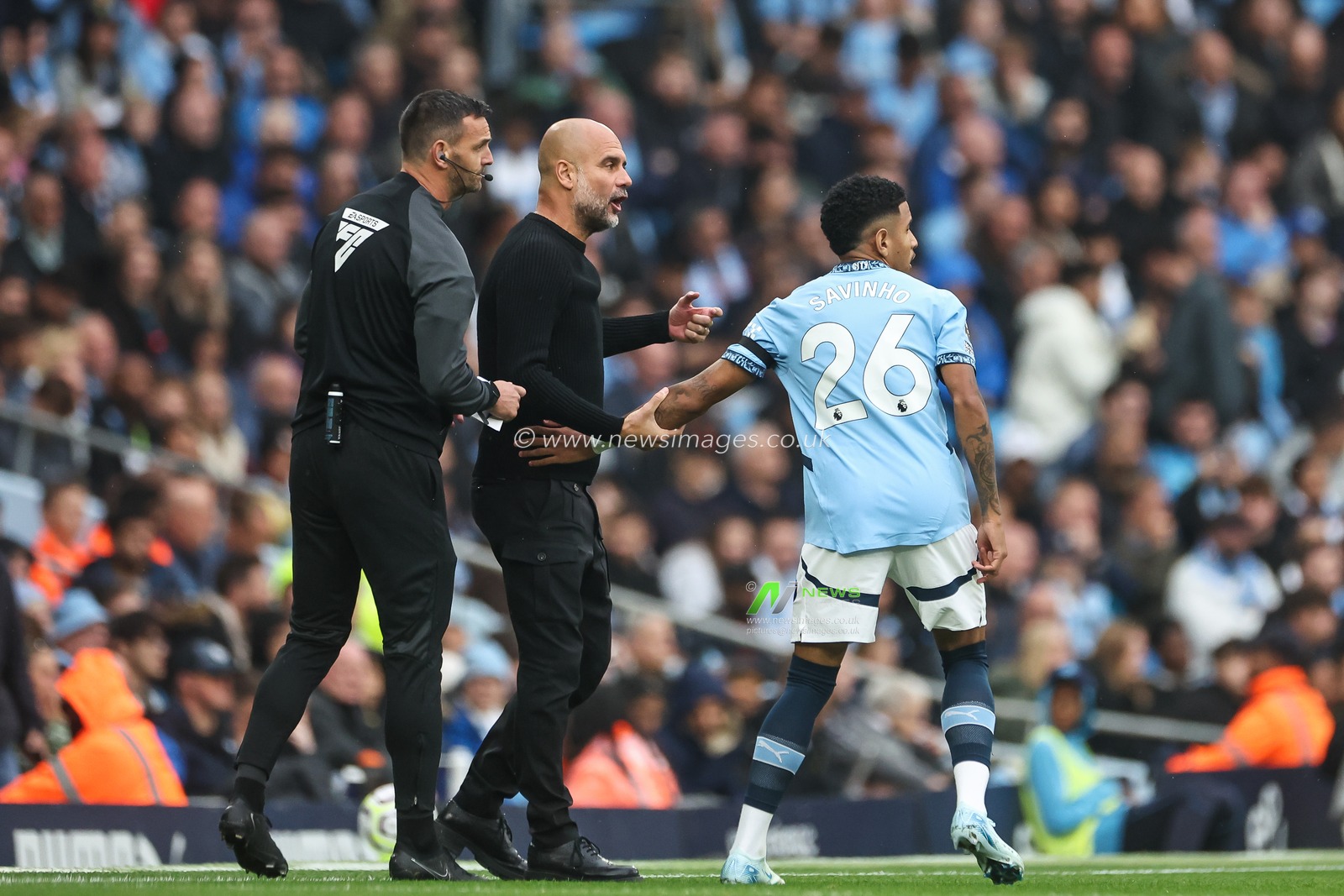 Pep Guardiola manager of Manchester City gives instructions to Savinho of Manchester City during the Premier League match Manchester City vs Arsenal at Etihad Stadium, Manchester, United Kingdom, 22nd September 2024

(Photo by Mark Cosgrove/News Images)