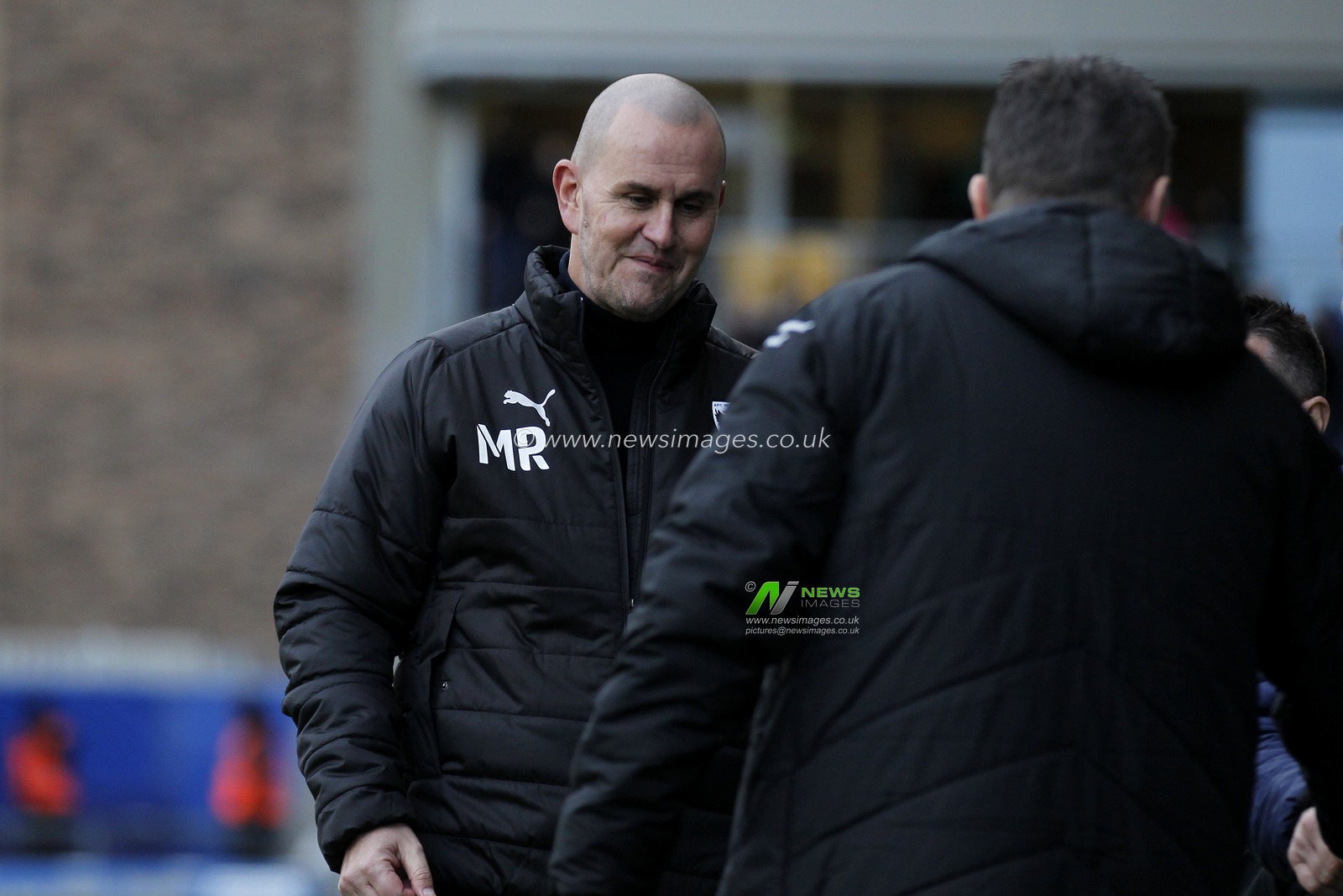 Mark Robinson manager of AFC Wimbledon greets Steve Cotterill manager of Shrewsbury Town
