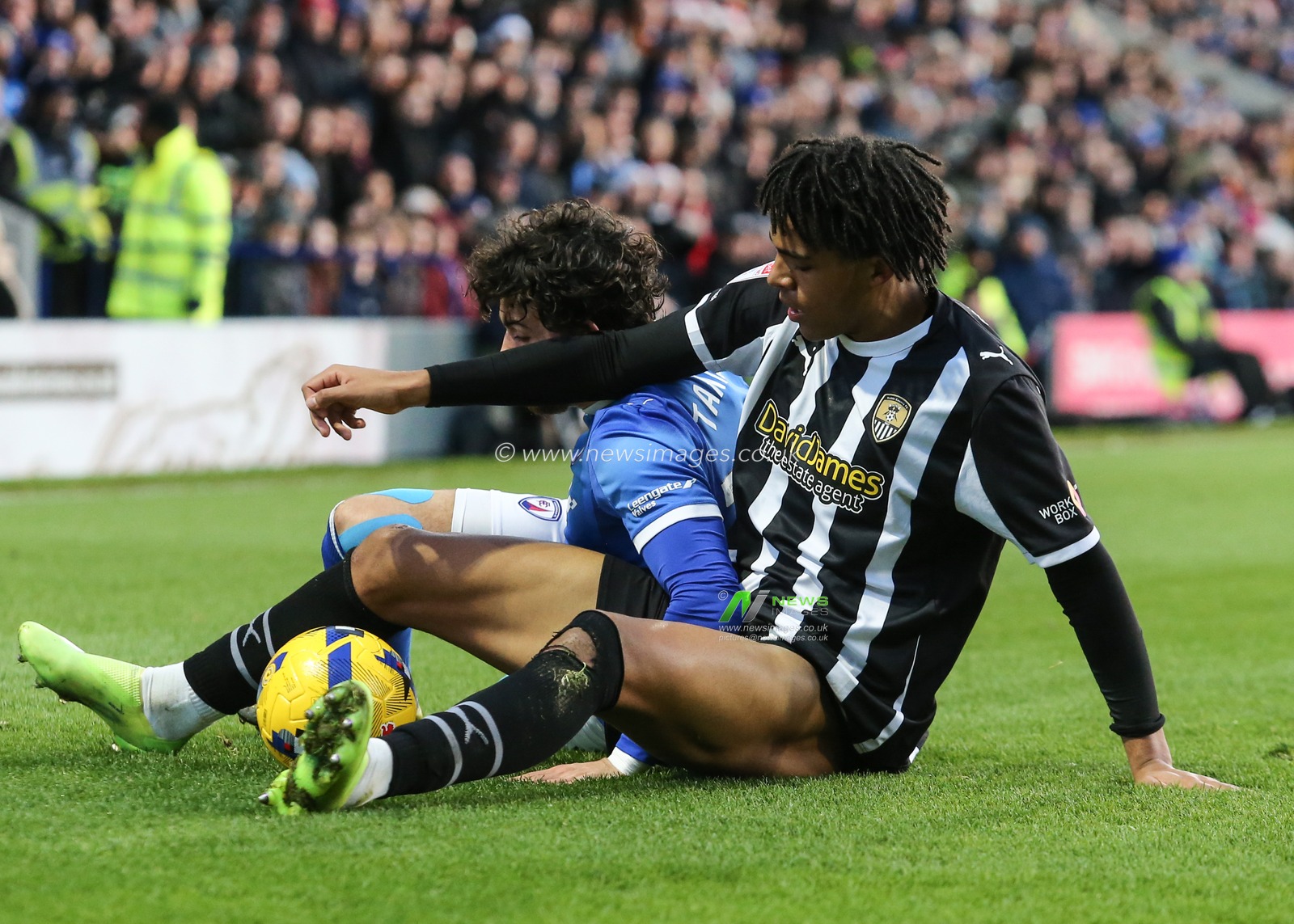 Devan Tanton of Chesterfield is tackled by Tom Iorpenda of Notts County during the Sky Bet League 2 match Chesterfield vs Notts County at SMH Group Stadium, Chesterfield, United Kingdom, 26th December 2025

(Photo by Richard Bierton/News Images)

*** GER AUT SUI OUT ***