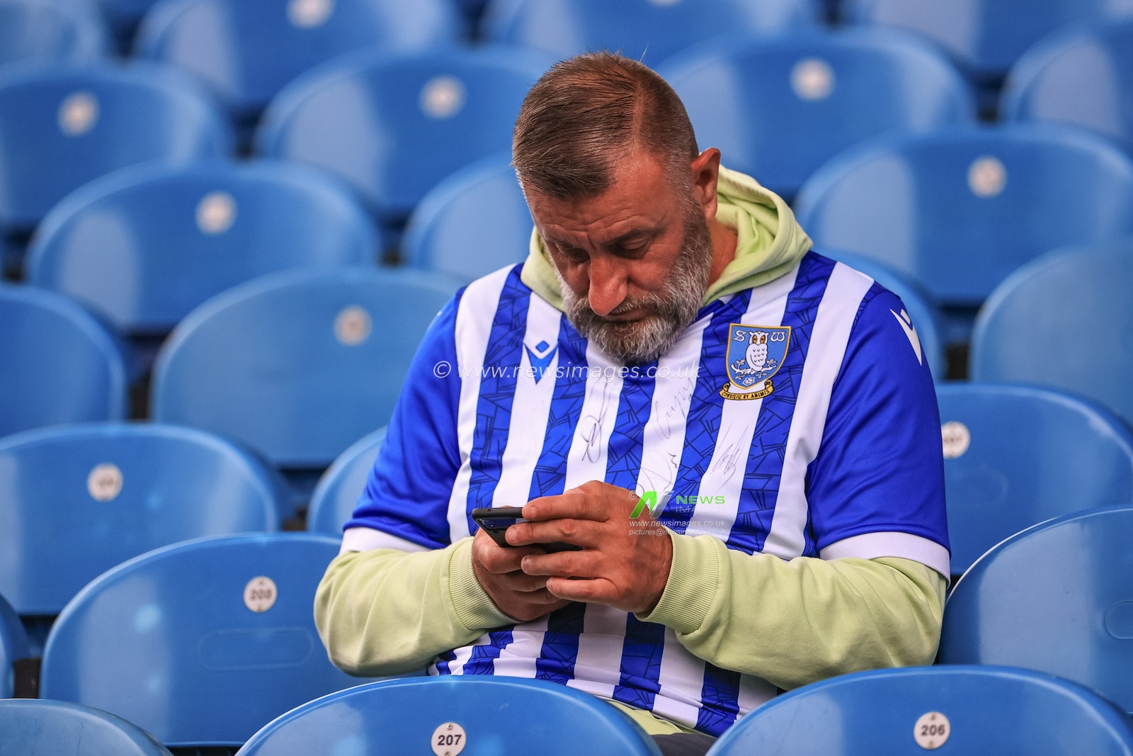 A  Sheffield Wednesday fan Sith a signed shirt