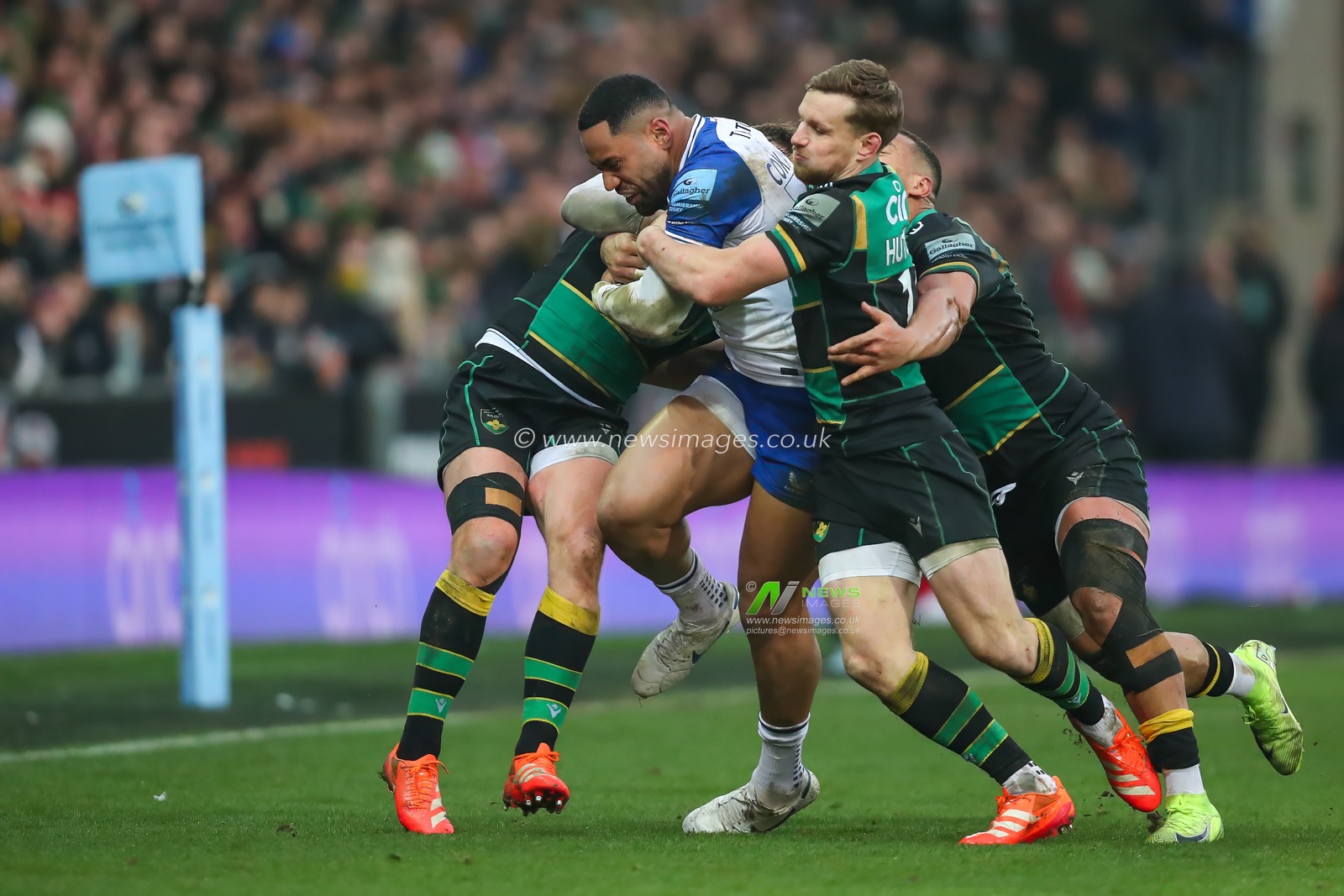 Joe Cokanasiga of Bath Rugby is gang tackled by the Northampton defence during the Gallagher Premiership match Northampton Saints vs Bath Rugby at Cinch Stadium at Franklin's Gardens, Northampton, United Kingdom, 5th January 2025

(Photo by Izzy Poles/News Images)
