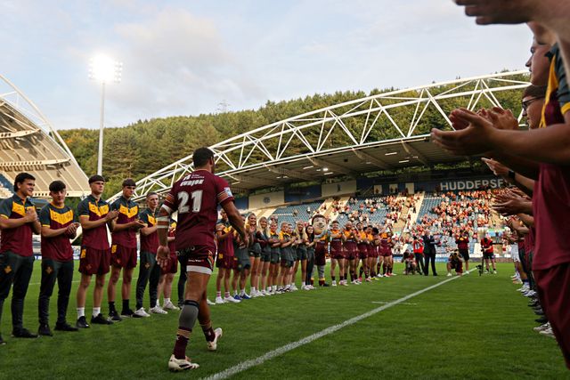 Leroy Cudjoe of Huddersfield Giants walks out to a guard of honour before the Betfred Super League round 19 match Huddersfield Giants vs Wakefield Trinity at the Accu Stadium, Huddersfield, United Kingdom, 18th July 2025

(Photo by Sam Eaden/News Images)