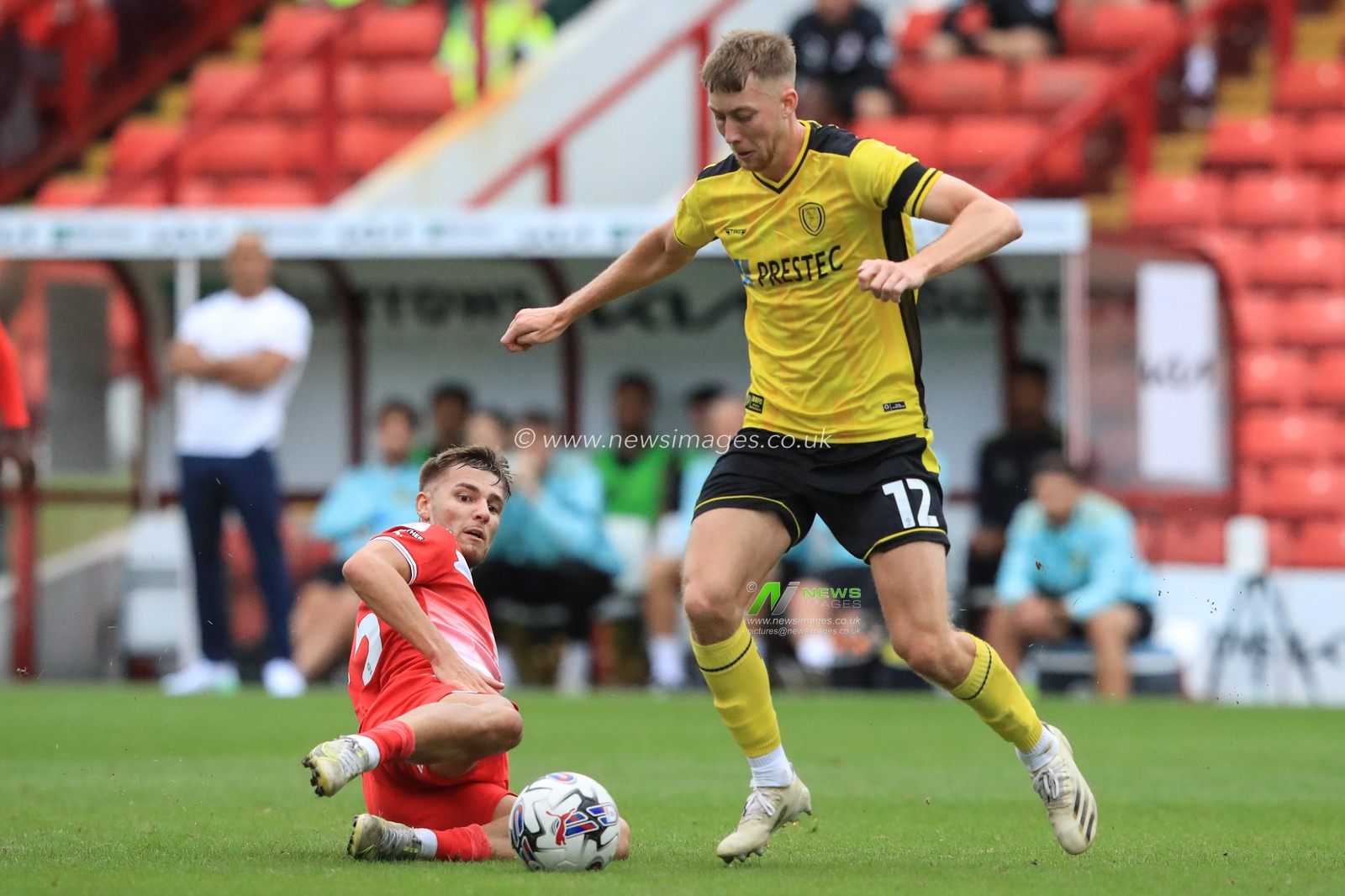 John Mcatee #45 of Barnsley tackles the ball from Jasper Moon #12 of Burton Albion during the Sky Bet League 1 match Barnsley vs Burton Albion at Oakwell, Barnsley, United Kingdom, 16th September 2023

(Photo by Alfie Cosgrove/News Images)
