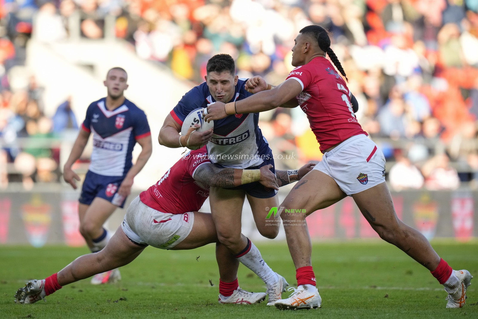 Victor Radley #13 of England is tackled during the Rugby League International match England vs Tonga at Totally Wicked Stadium, St Helens, United Kingdom, 22nd October 2023

(Photo by Steve Flynn/News Images)