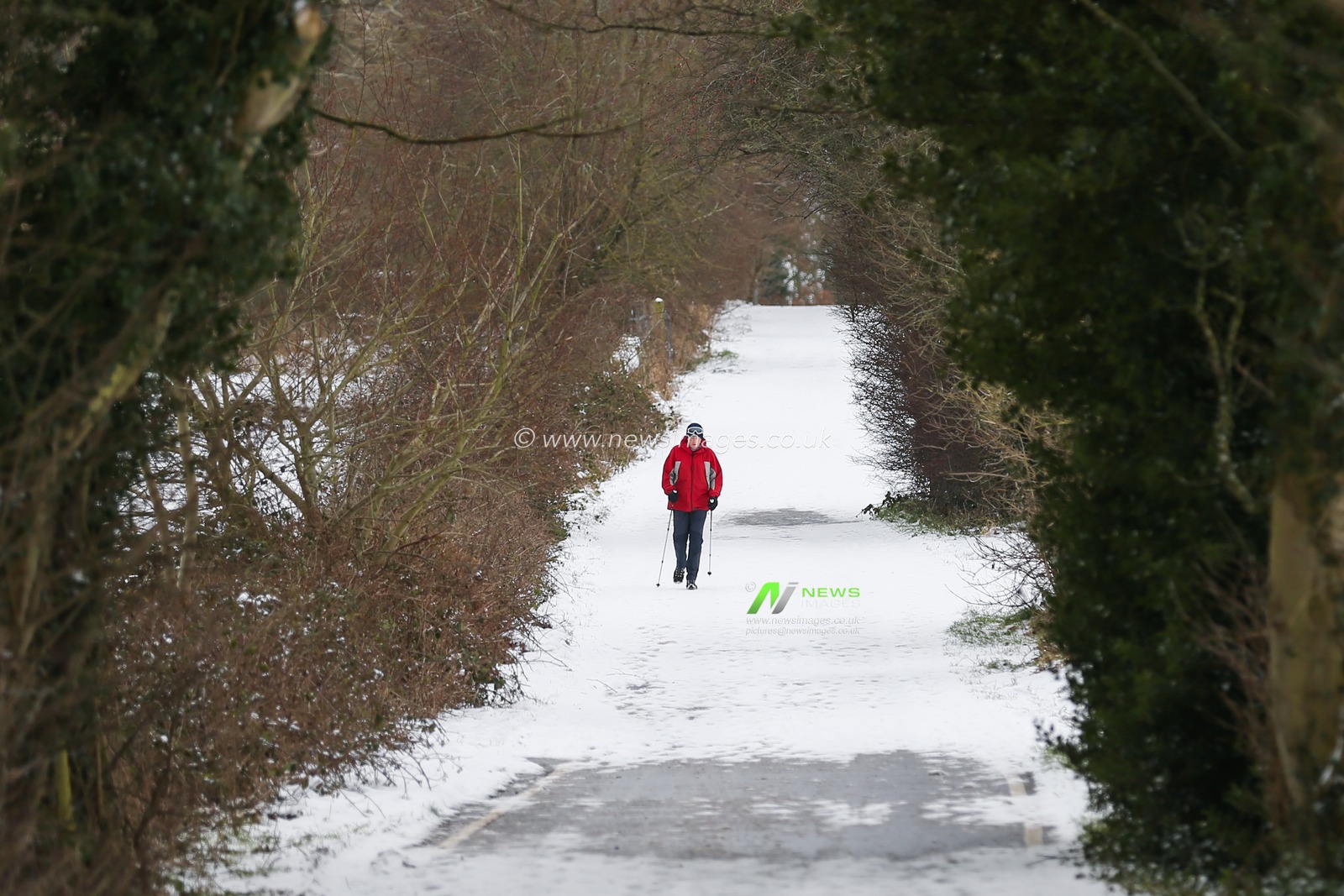A walker is seen on an icy path