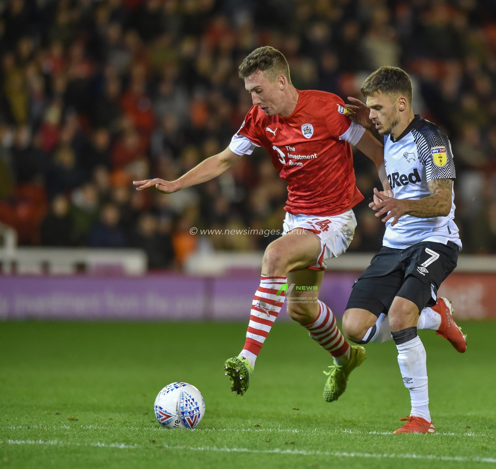 2nd October 2019, Oakwell, Barnsley, England; Sky Bet Championship, Barnsley v Derby County :Aapo Halme (24) of Barnsley FC holds off Jamie Paterson (7) of Derby County

Credit: Dean Williams/News Images