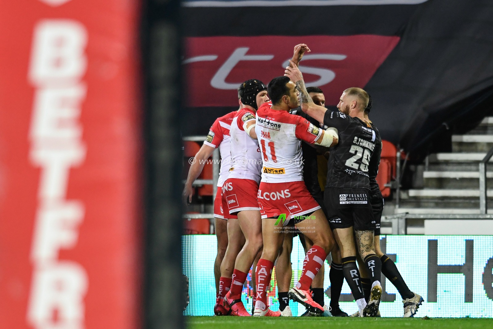 Players from both sides clash on the pitch