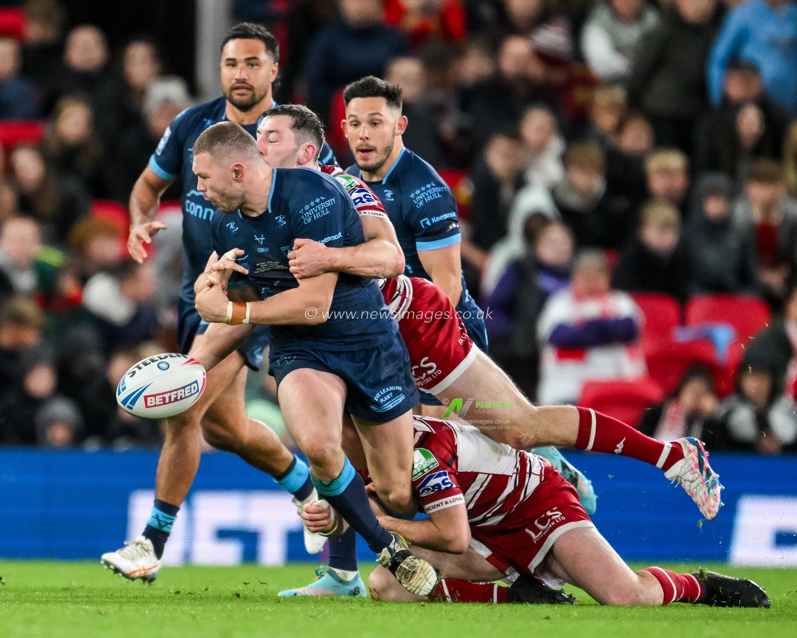 James Batchelor of Hull KR spills the ball during the tackle from Jake Wardle of Wigan Warriors during the Betfred Super League Grand Final match Wigan Warriors vs Hull KR at Old Trafford, Manchester, United Kingdom, 12th October 2024

(Photo by Craig Thomas/News Images)