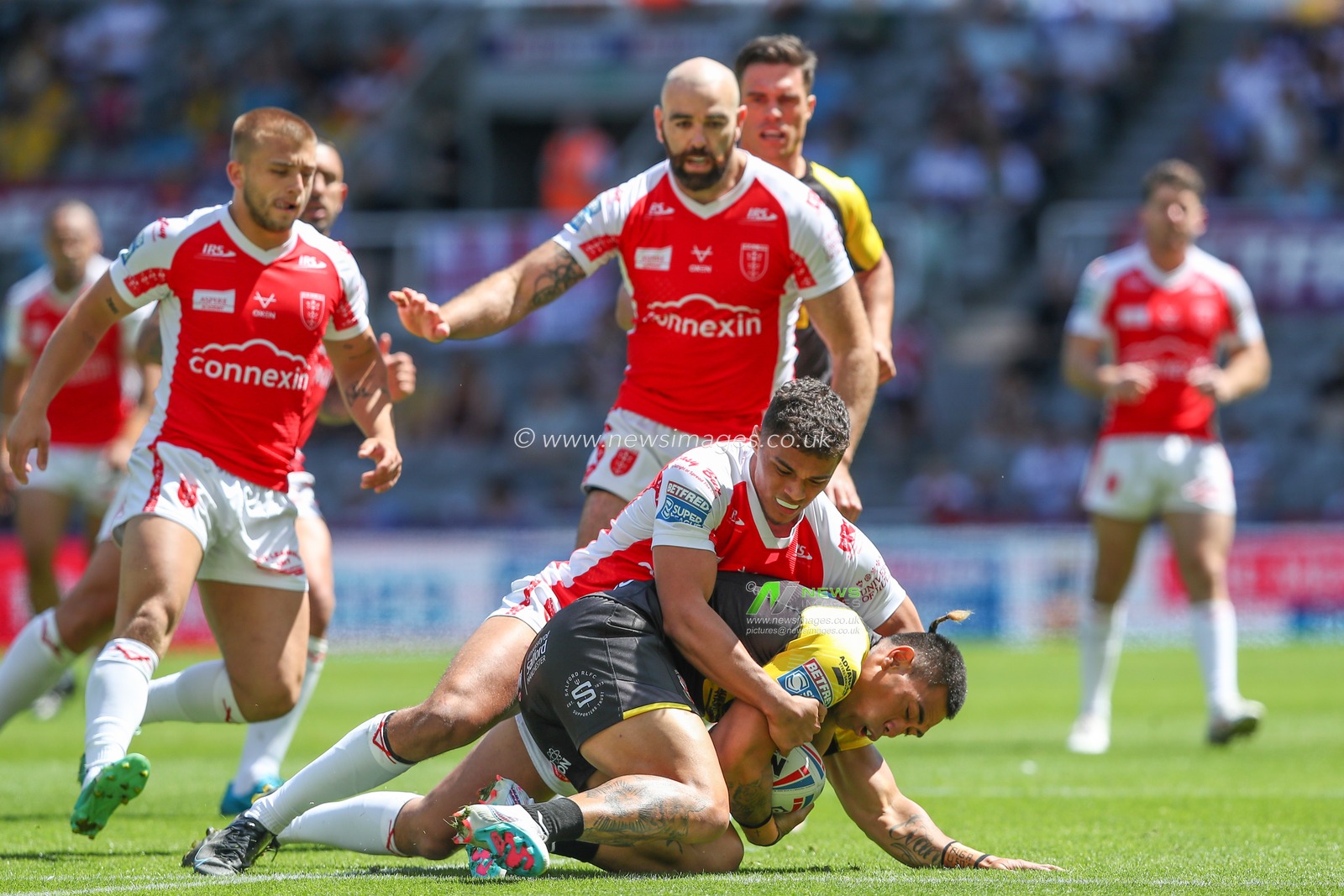 Ken Sio #2 of Salford Red Devils is tackled by Corey Hall #33 of Hull KR during the Betfred Super League Magic Weekend match Salford Red Devils vs Hull KR at St. James's Park, Newcastle, United Kingdom, 3rd June 2023

(Photo by Gareth Evans/News Images)