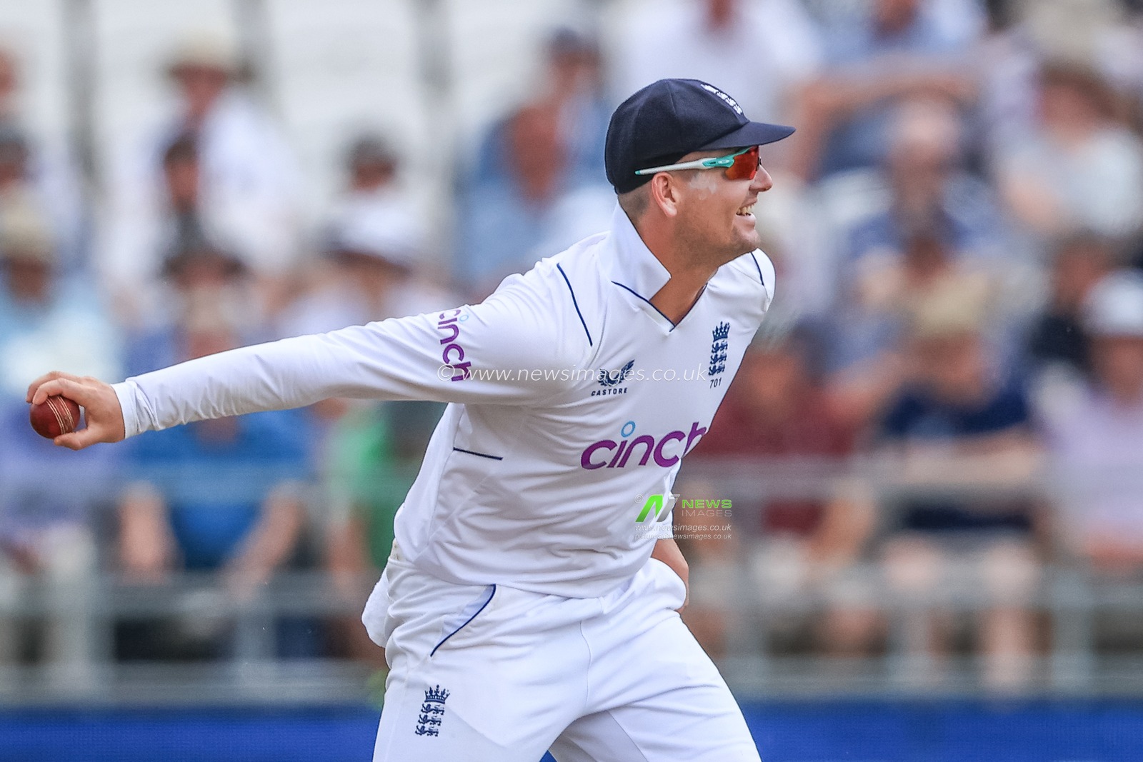 Alex Lees of England throws the ball