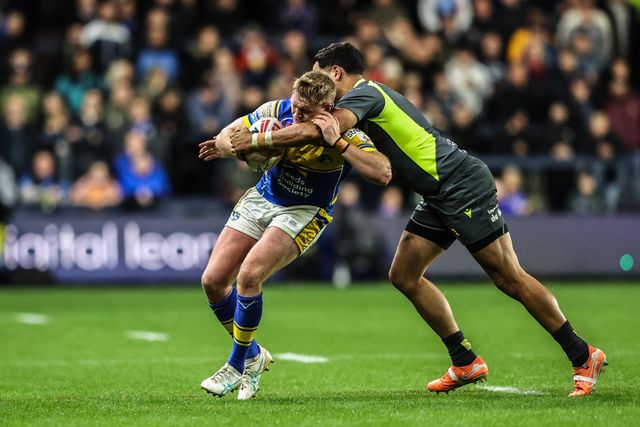 James McDonnell of Leeds Rhinos is tackled by Reimis Smith of Catalan Dragons during the Betfred Super League round 26 match Leeds Rhinos vs Catalans Dragons at Headingley Stadium, Leeds, United Kingdom, 11th September 2025

(Photo by Alfie Cosgrove/News Images)