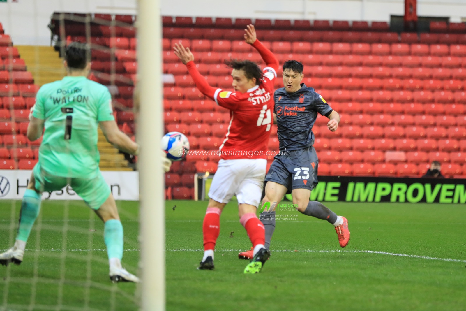 Joe Lolley #23 of Nottingham Forest shoots on goal, saves by Jack Walton #1 of Barnsley