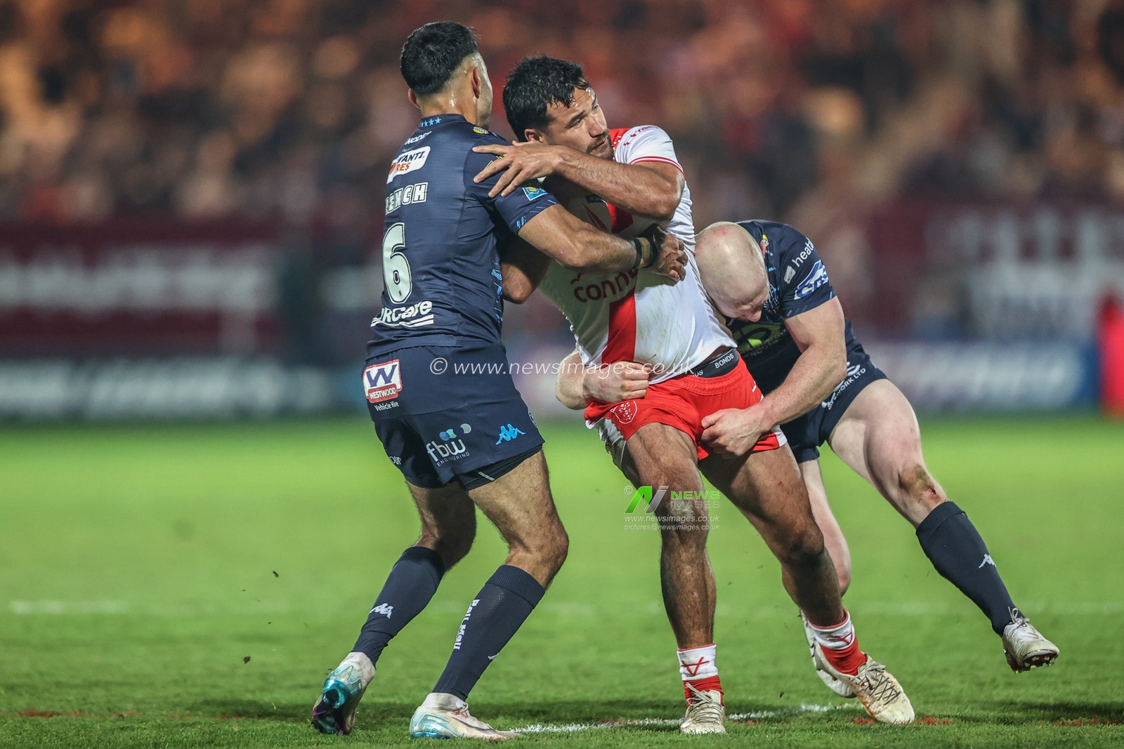 Peta Hiku of Hull KR is tackled by Bevan French of Wigan Warriors and Liam Farrell of Wigan Warriors during the Betfred Super League Round 7 match Hull KR vs Wigan Warriors at Sewell Group Craven Park, Kingston upon Hull, United Kingdom, 11th April 2025

(Photo by Alfie Cosgrove/News Images)