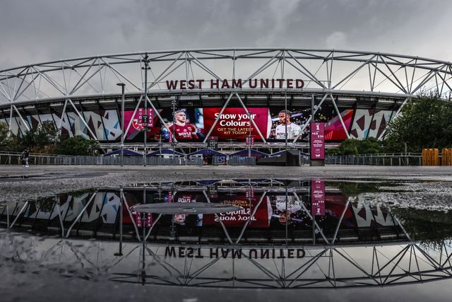 A reflection of the London Stadium through a puddle during the Premier League match West Ham United vs Brentford at London Stadium, London, United Kingdom, 20th October 2025

(Photo by Mark Cosgrove/News Images)