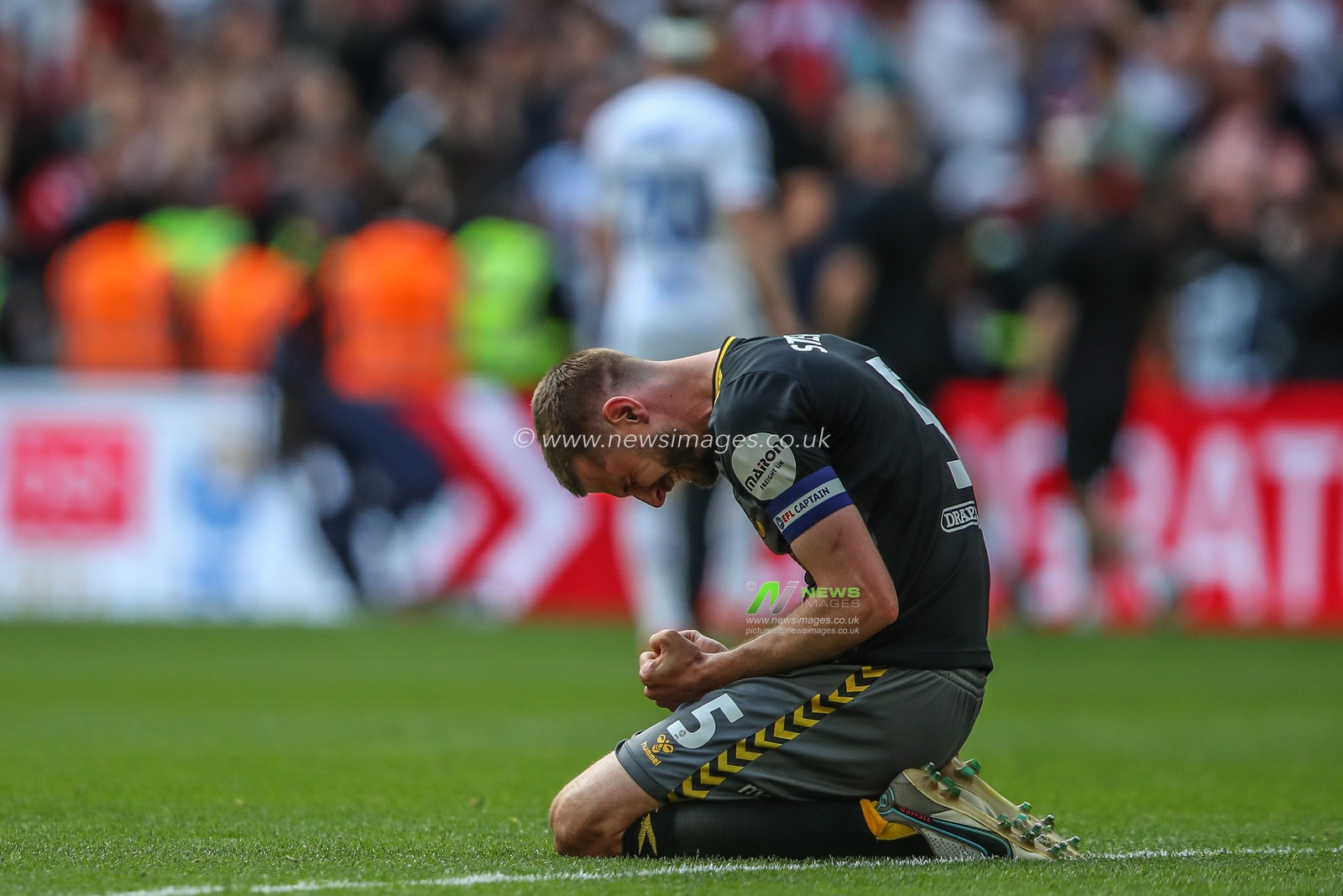 Jack Stephens of Southampton celebrates his team winning promotion to the Premier League during the Sky Bet Championship Play-Off Final match Leeds United vs Southampton at Wembley Stadium, London, United Kingdom, 26th May 2024

(Photo by Gareth Evans/News Images)