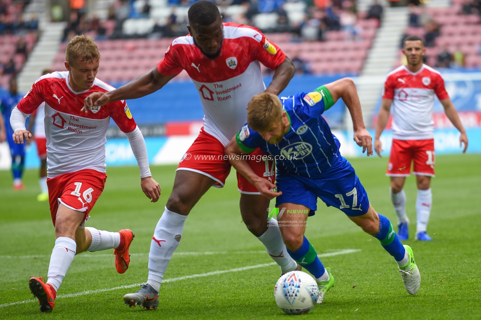 31st August  2019, DW Stadium, Wigan, England; Sky Bet Championship Football, Wigan Athletic vs Barnsley ; Michael Jacobs (17) of Wigan Athletic and Luke Thomas (16) of Barnsley contest the ball


Credit:Richard Long/News Images

English Football League images are subject to DataCo Licence