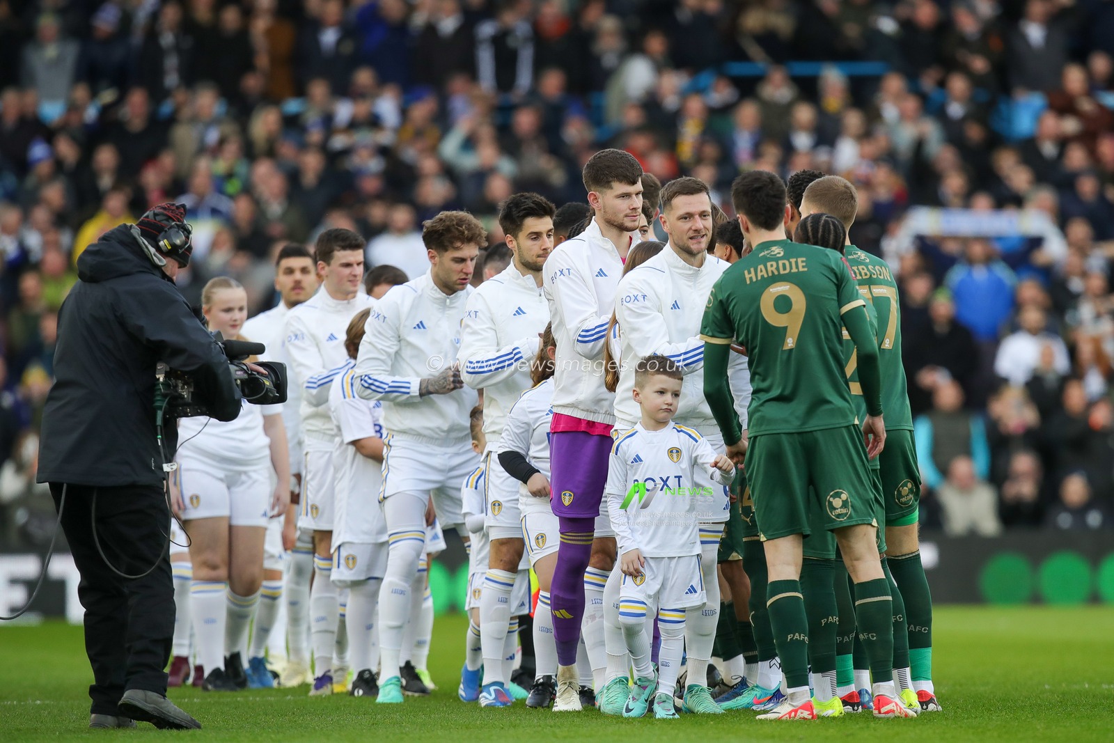 The two teams shake hands ahead of the Emirates FA Cup  Fourth Round match Leeds United vs Plymouth Argyle at Elland Road, Leeds, United Kingdom, 27th January 2024

(Photo by James Heaton/News Images)