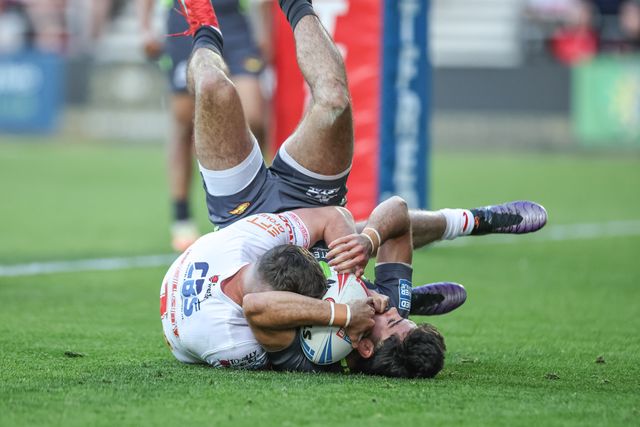Jack Welsby of St. Helens tackles Guillermo Aispuro-Bichet of Catalan Dragons behind his own goal line for a re-set during the Betfred Super League Round 11 match St Helens vs Catalans Dragons at Totally Wicked Stadium, St Helens, United Kingdom, 15th May 2025

(Photo by Mark Cosgrove/News Images)