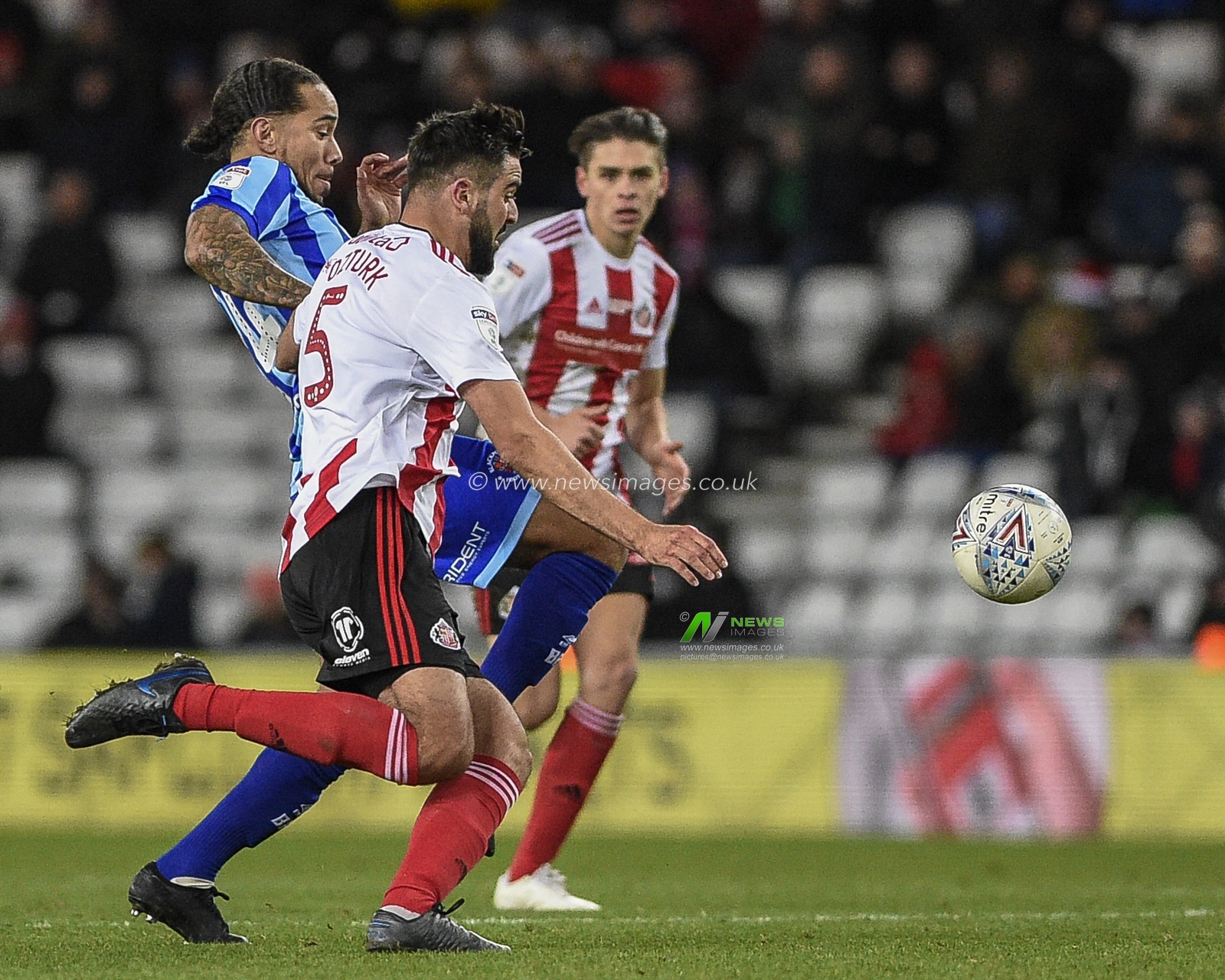 14th December 2019, Stadium Of Light, Sunderland, England; Sky Bet League 1, Sunderland v Blackpool : Sean Scannell (14) of Blackpool and Alim Ã–ztÃ¼rk (5) of Sunderland tussle for the ball

Credit: Iam Burn/News Images