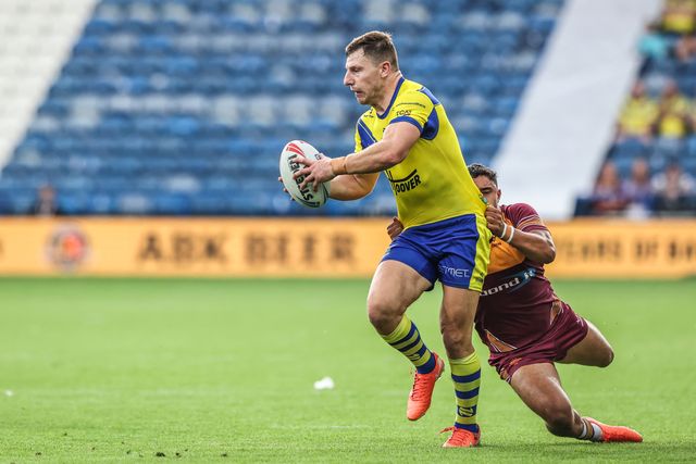 George Williams of Warrington Wolves is tackled during the Betfred Super League Round 23 match Huddersfield Giants vs Warrington Wolves at Accu Stadium, Huddersfield, United Kingdom, 24th August 2025

(Photo by Alfie Cosgrove/News Images)