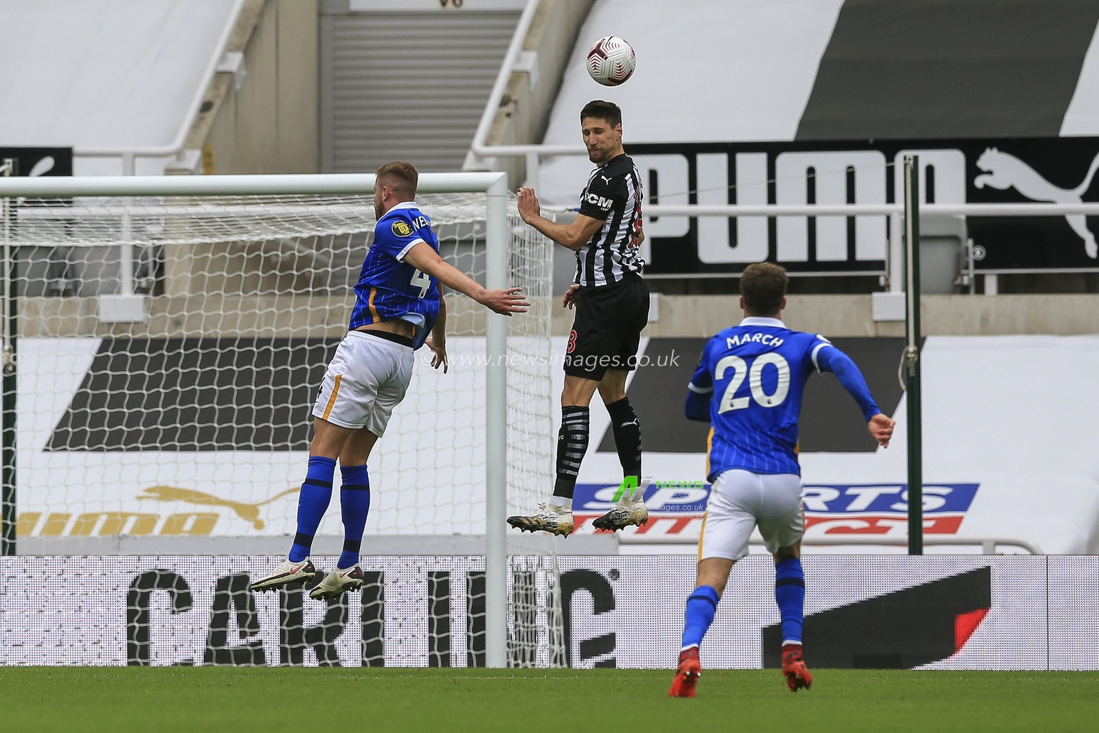 Federico FernÃ¡ndez (18) of Newcastle United heads the ball away from the Newcastle United penalty area