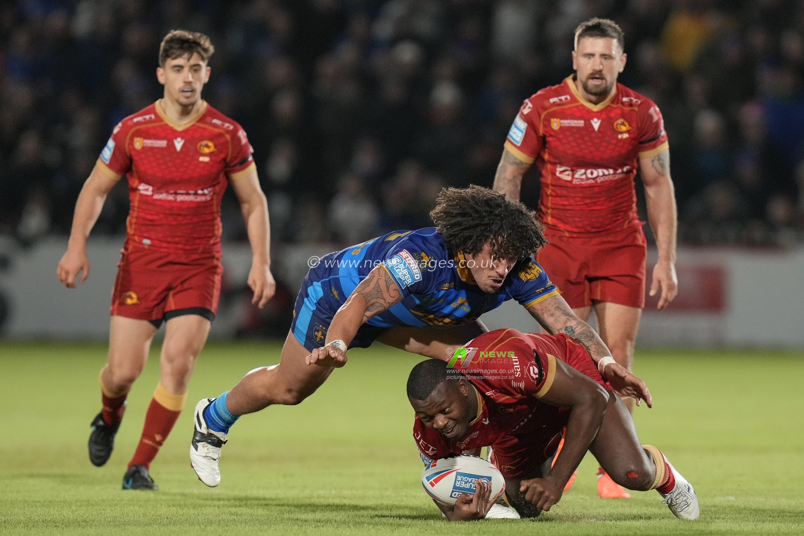 Kevin Proctor #19 of Wakefield Trinity tackles Jordan Dezaria #23 of Catalans Dragons during the Betfred Super League  Round 1 match Wakefield Trinity vs Catalans Dragons at The Be Well Support Stadium, Wakefield, United Kingdom, 17th February 2023

(Photo by Steve Flynn/News Images)