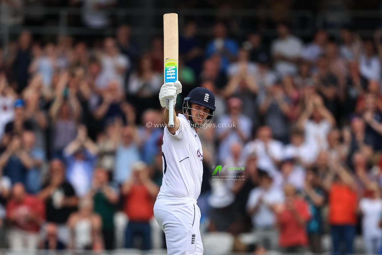 Jamie Overton of England celebrates a half century (50 runs) on his test debut