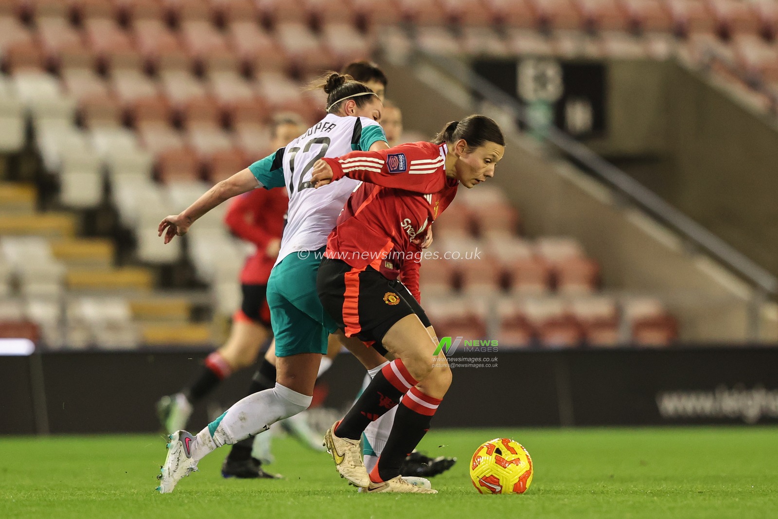 Deanna Cooper of Newcastle and Rachel Williams of Manchester United battle for the ball during the Women's League Cup - Group Stage - Group A Manchester United Women v Newcastle United women at Leigh Sports Village, Leigh, United Kingdom, 11th December 2024

(Photo by Alfie Cosgrove/News Images)