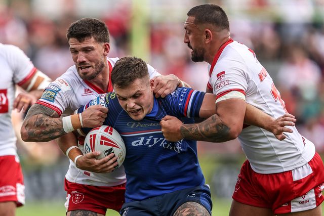 Cameron Scott of Wakefield Trinity is tackled by Elliot Minchella of Hull KR and Oliver Gildart of Hull KR during the Betfred Super League round 18 match Hull KR vs Wakefield Trinity at Sewell Group Craven Park, Hull, United Kingdom on 11 July 2026

(Photo by Alfie Cosgrove/News Images)