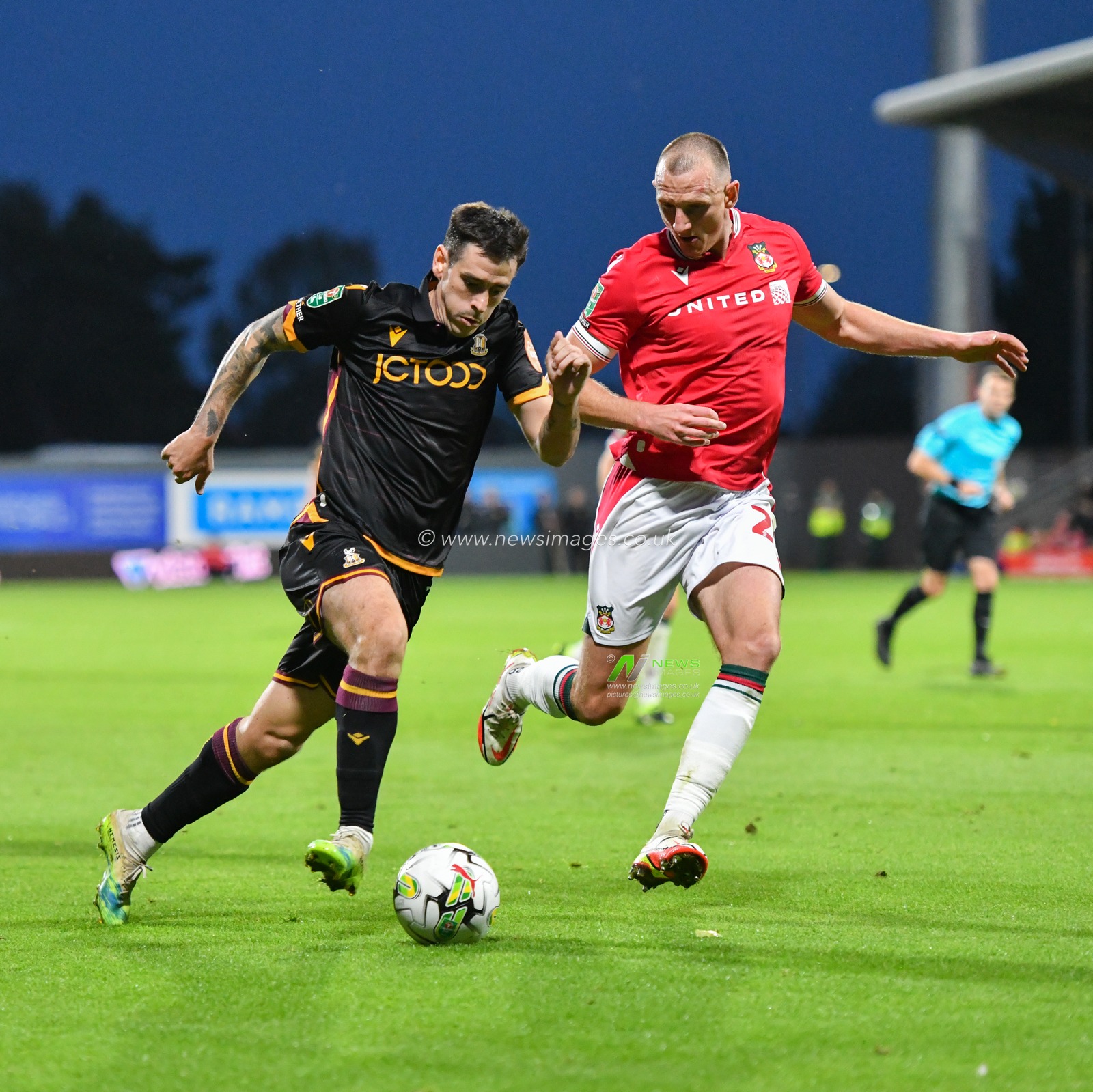 Bradfordâ€™s Jamie Walker runs down the wing while being chased down by Wrexham's William Boyle, during the Carabao Cup match Wrexham vs Bradford City at The Racecourse Ground, Wrexham, United Kingdom, 29th August 2023

(Photo by Cody Froggatt/News Images)